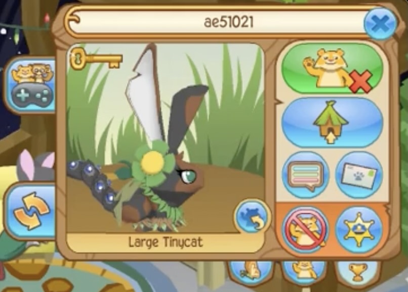 An Animal Jam user's playercard. The bunny is grey with brown splotches and green eyes. She has a green and yellow rare head flower, a green leaf necklace, a green worn, green and brown rare leg armor (2014), and black and blue elf tail armor. The username is ae51021 and the bunny is named Large Tinycat.