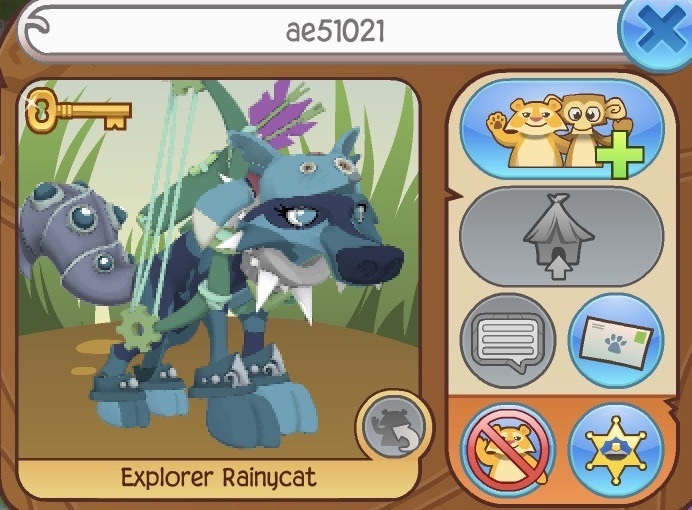 An Animal Jam player card. There is a wolf of various splotches and shades of blue facing the viewer. She has a blue fox hat, silver spike, green bow and arrows, blue elf braclets, and blue tail armor. The username displayed is ae51021, and the wolf's name is Explorer Rainycat.