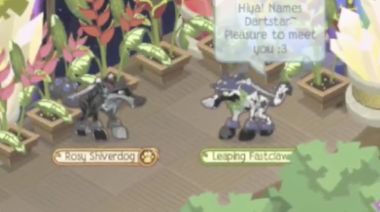An image of two Animal Jam players in a den, surrounded by nature items. On the left is Greyfur, whose wolf is named Rosy Shiverdog with an orange player tag. She is grey and light grey with a black lightning pattern and blue eyes. She has no head item, a light grey leaf necklace, a black pirate sword, grey elf bracelets, and blue and black tail armor. On the right is Dartstar, whose wolf is named Leaping Fastclaw with a green player tag. She is white and black with grey star markings and white eyes. She has a purple fox hat, a green leaf necklace, a pirate sword, and grey elf bracelets.